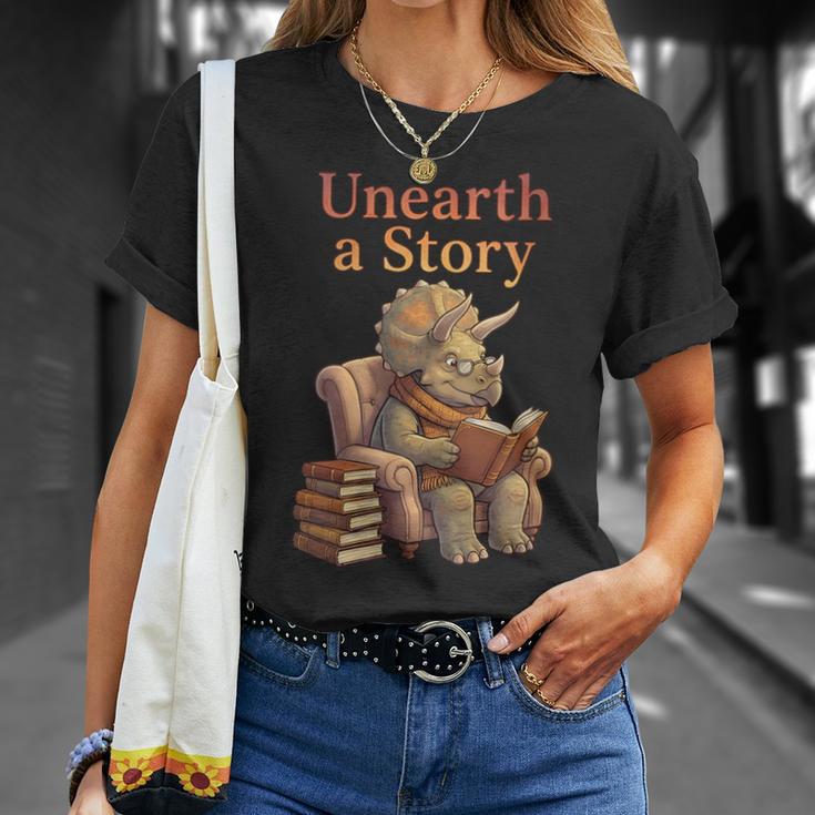 Women's Unearth a Story Triceratops Dinosaur Reading Books Dino T-Shirt Gifts for Her Women's Unearth a Story Triceratops Dinosaur Reading Books Dino T-Shirt Gifts for Her