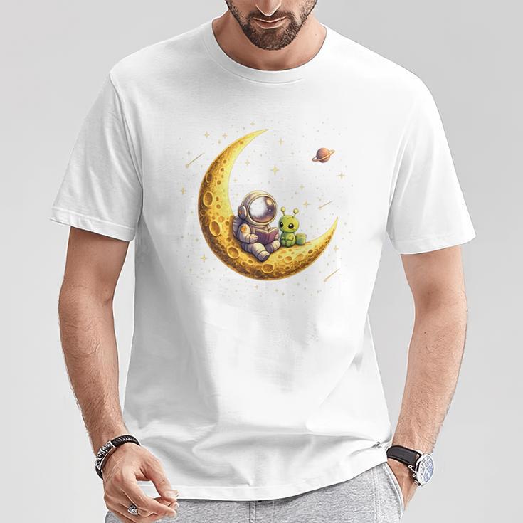 Astronaut Reading Book To Alien Moon Space Astronomy T-Shirt Unique Gifts
