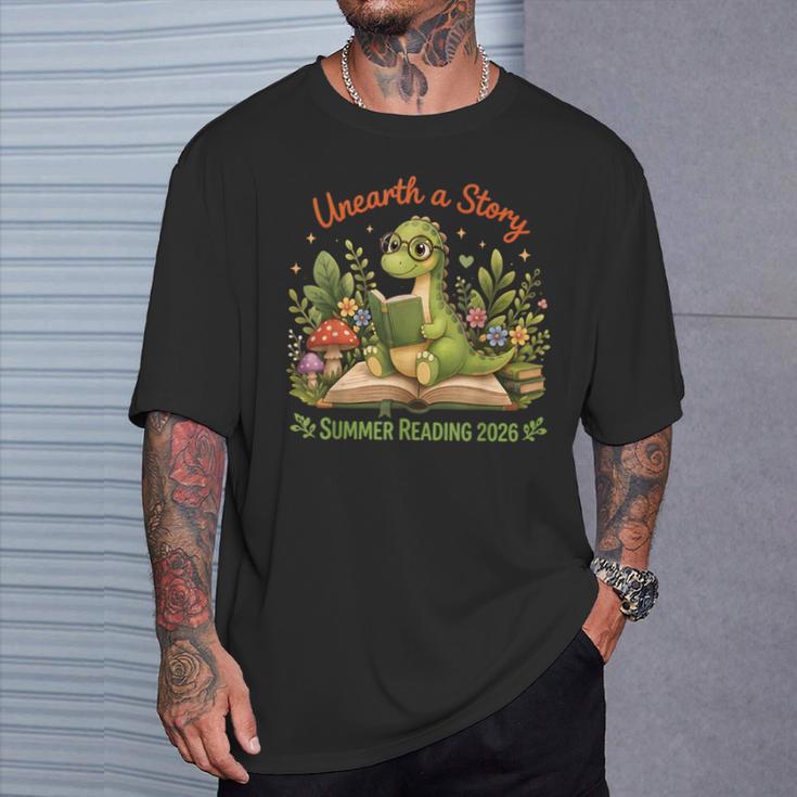 Unearth A Story Summer Reading 2026 Dinosaur Reading Books T-Shirt Gifts for Him Unearth A Story Summer Reading 2026 Dinosaur Reading Books T-Shirt Gifts for Him