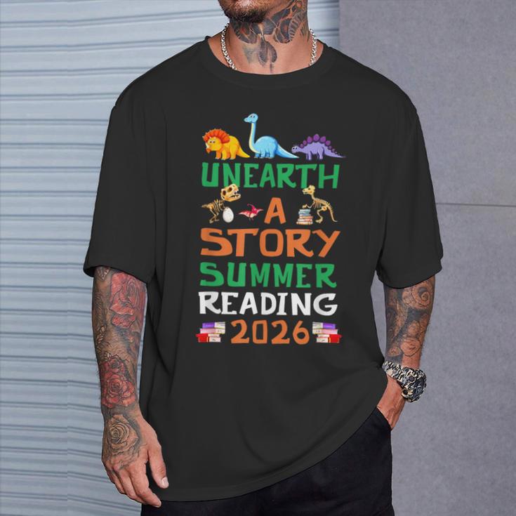 Unearth A Story Summer Reading Program 2026 Dinosaur Book T-Shirt Gifts for Him Unearth A Story Summer Reading Program 2026 Dinosaur Book T-Shirt Gifts for Him