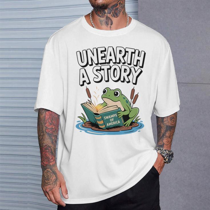Unearth a Story Frog Reading a Book Summer 2026 Premium Tri-Blend T-Shirt Gifts for Him