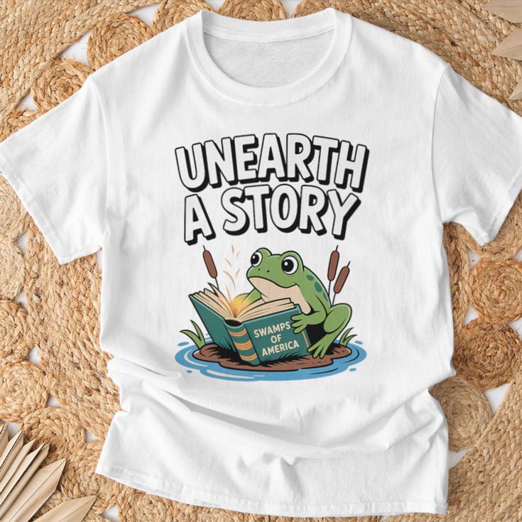 Unearth a Story Frog Reading a Book Summer 2026 Premium Tri-Blend T-Shirt Gifts for Old Men
