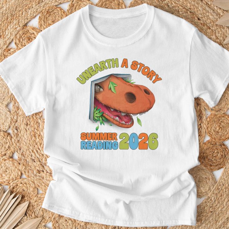 Unearth A Story Summer Reading 2026 Dinosaur Book Lover Dino Premium Tri-Blend T-Shirt Gifts for Old Men Unearth A Story Summer Reading 2026 Dinosaur Book Lover Dino Premium Tri-Blend T-Shirt Gifts for Old Men