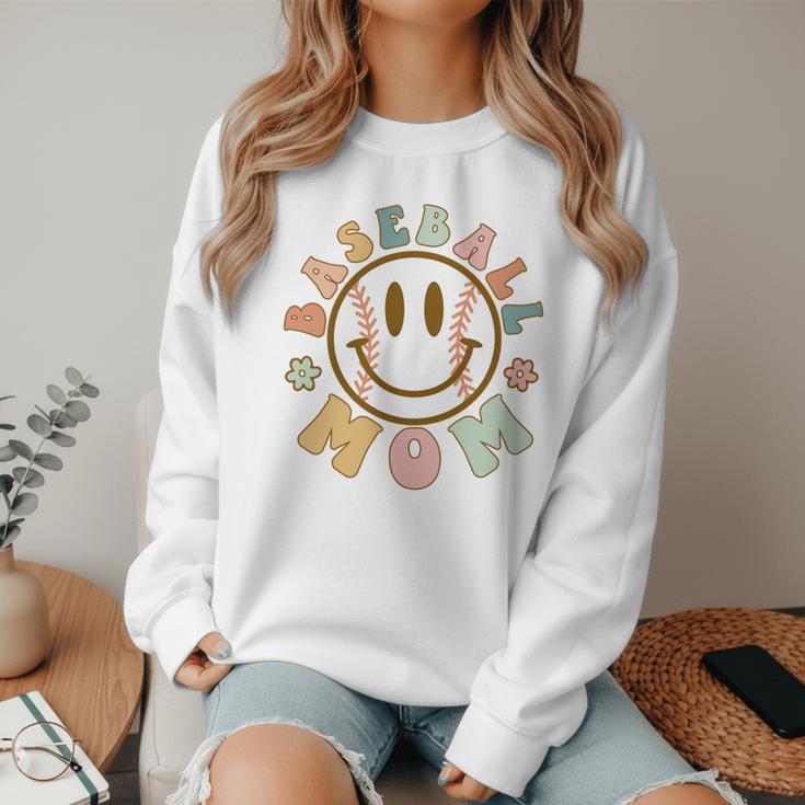 Happy Baseball Mom Groovy Retro Floral Smiling Face Women Crewneck Sweatshirt Happy Baseball Mom Groovy Retro Floral Smiling Face Women Crewneck Sweatshirt