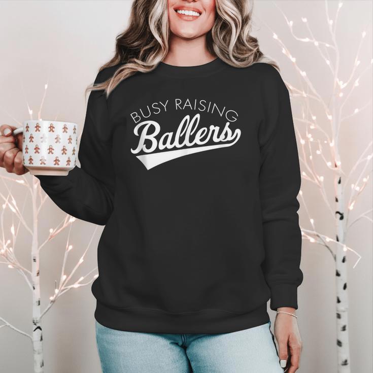 Busy Raising Ballers Baseball Mom & Parent Sports Women Crewneck Sweatshirt Busy Raising Ballers Baseball Mom & Parent Sports Women Crewneck Sweatshirt