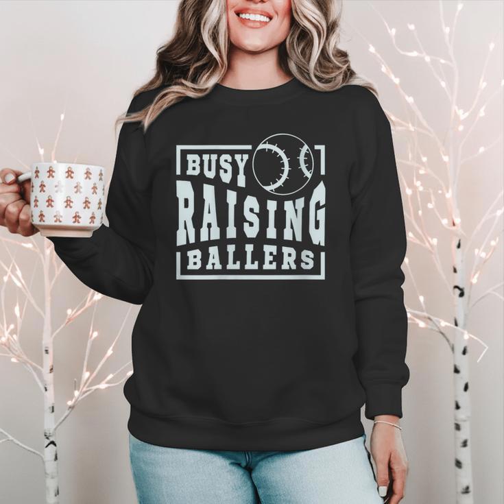 Busy Raising Ballers Graphic For Baseball Moms Women Crewneck Sweatshirt Busy Raising Ballers Graphic For Baseball Moms Women Crewneck Sweatshirt