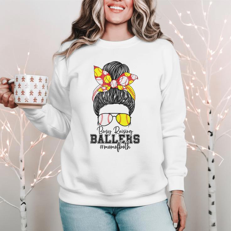 Busy Raising Ballers Softball Messy Bun Baseball Mom Women Crewneck Sweatshirt Busy Raising Ballers Softball Messy Bun Baseball Mom Women Crewneck Sweatshirt