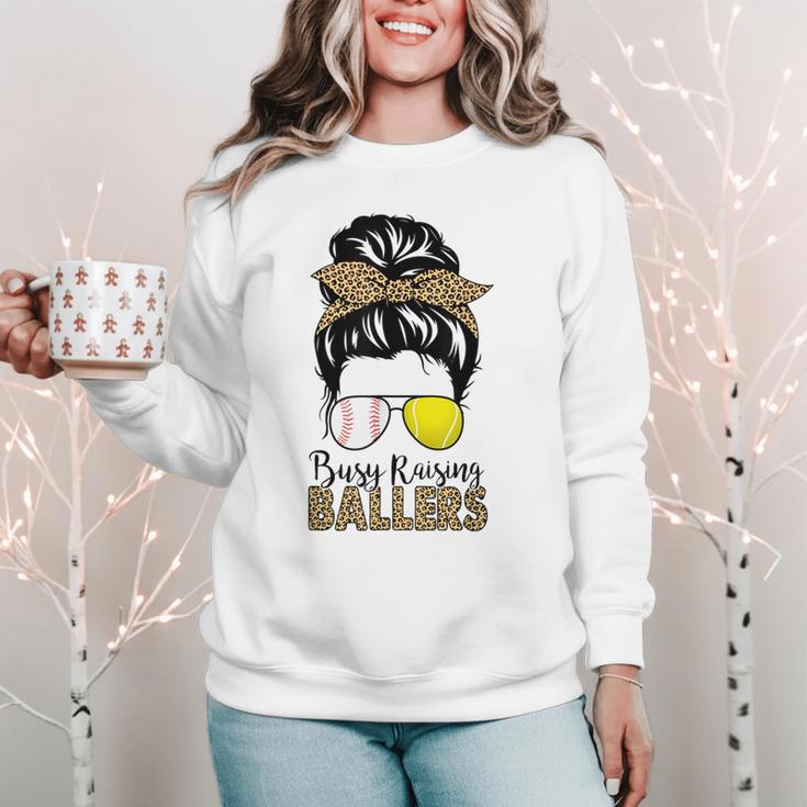 Busy Raising Ballers Tennis Baseball Mom Messy Bun Leopard Women Crewneck Sweatshirt Busy Raising Ballers Tennis Baseball Mom Messy Bun Leopard Women Crewneck Sweatshirt
