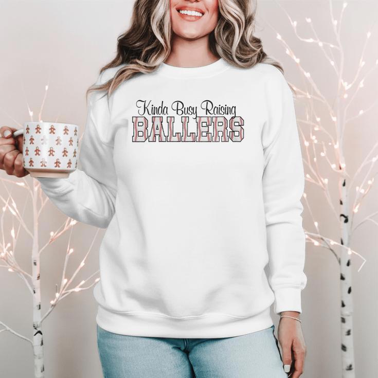 Kinda Busy Raising Ballers Funny Baseball Mom Mother's Day Women Crewneck Sweatshirt Kinda Busy Raising Ballers Funny Baseball Mom Mother's Day Women Crewneck Sweatshirt