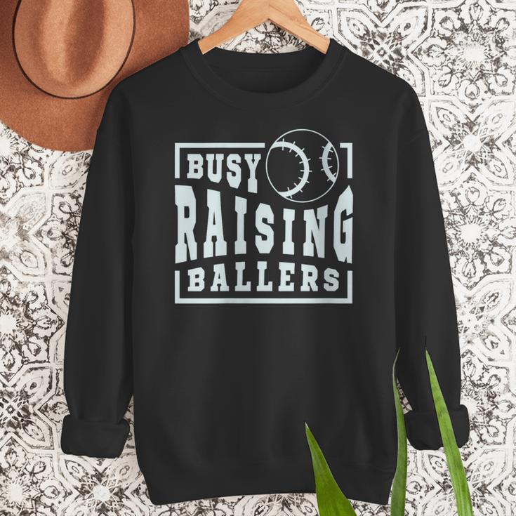 Busy Raising Ballers Graphic For Baseball Moms Women Crewneck Sweatshirt Busy Raising Ballers Graphic For Baseball Moms Women Crewneck Sweatshirt