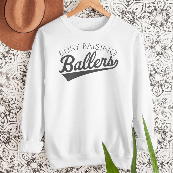 Busy Raising Ballers Baseball Mom & Parent Sports Premium Tri-Blend Women Crewneck Sweatshirt