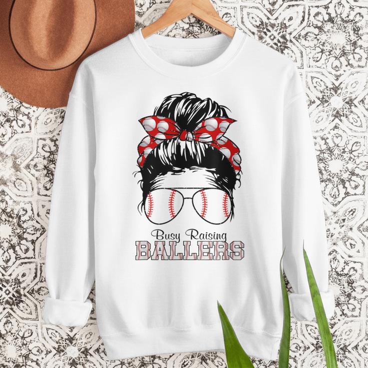 Busy Raising Ballers Messy Bun Funny Baseball Mom Women Crewneck Sweatshirt Busy Raising Ballers Messy Bun Funny Baseball Mom Women Crewneck Sweatshirt