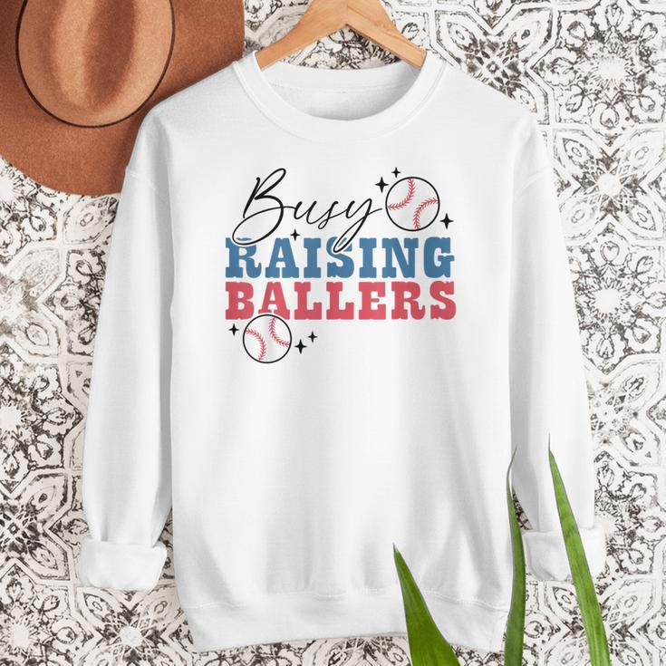 Busy Raising Ballers Retro Groovy Baseball Mom Outfit Women Crewneck Sweatshirt Busy Raising Ballers Retro Groovy Baseball Mom Outfit Women Crewneck Sweatshirt