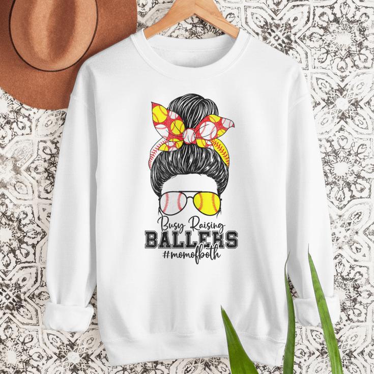 Busy Raising Ballers Softball Messy Bun Baseball Mom Women Crewneck Sweatshirt Busy Raising Ballers Softball Messy Bun Baseball Mom Women Crewneck Sweatshirt