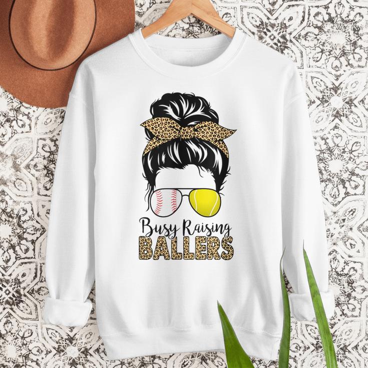 Busy Raising Ballers Tennis Baseball Mom Messy Bun Leopard Women Crewneck Sweatshirt Busy Raising Ballers Tennis Baseball Mom Messy Bun Leopard Women Crewneck Sweatshirt