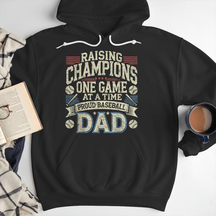 Proud Baseball Dad Raising Champions One Game At A Time Men Hoodie Proud Baseball Dad Raising Champions One Game At A Time Men Hoodie