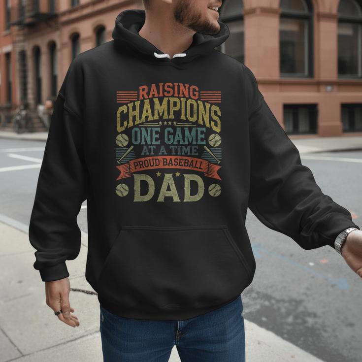 Raising Champions One Game At A Time Proud Baseball Dad Men Hoodie Raising Champions One Game At A Time Proud Baseball Dad Men Hoodie