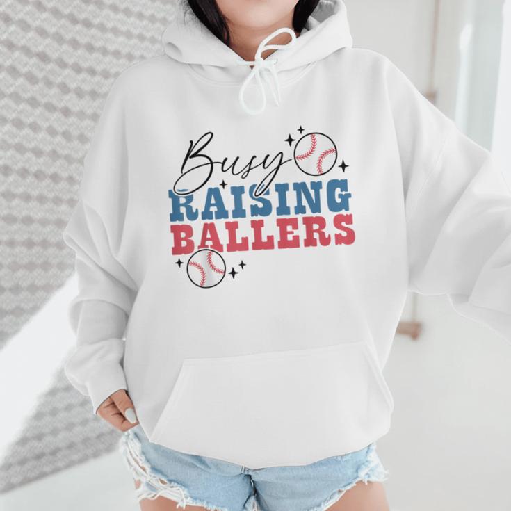 Busy Raising Ballers Retro Groovy Baseball Mom Outfit Wmen Hoodie Busy Raising Ballers Retro Groovy Baseball Mom Outfit Wmen Hoodie