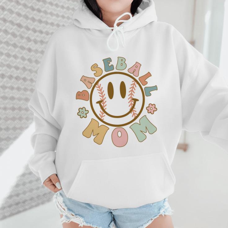 Happy Baseball Mom Groovy Retro Floral Smiling Face Wmen Hoodie Happy Baseball Mom Groovy Retro Floral Smiling Face Wmen Hoodie