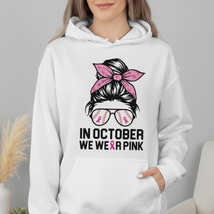 In October We Wear Pink Baseball Mom Messy Bun Breast Cancer Wmen Hoodie In October We Wear Pink Baseball Mom Messy Bun Breast Cancer Wmen Hoodie