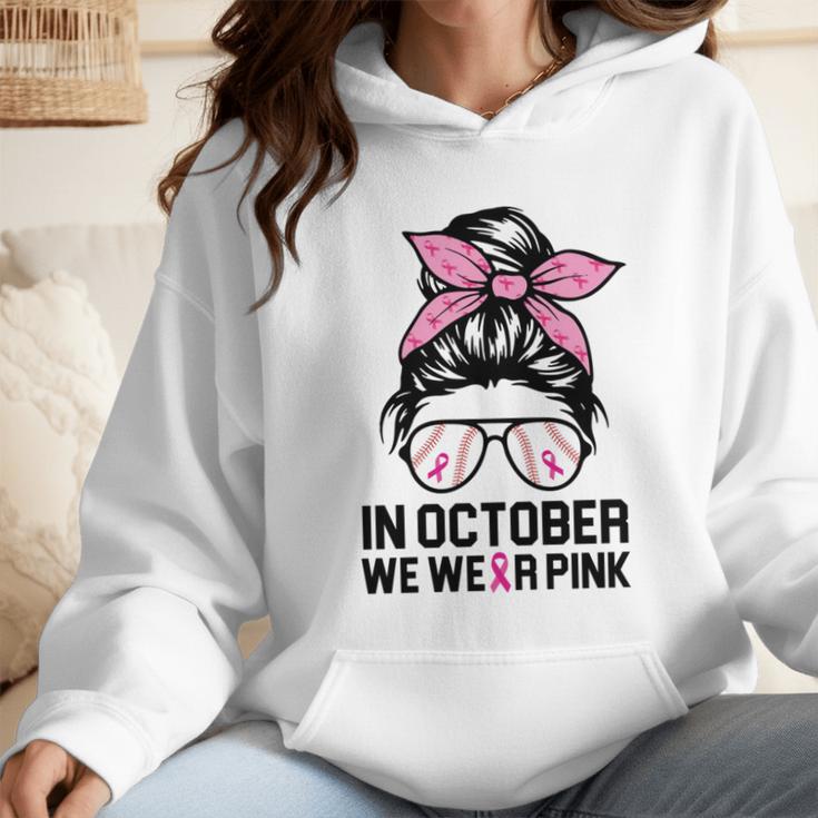 In October We Wear Pink Baseball Mom Messy Bun Breast Cancer Wmen Hoodie In October We Wear Pink Baseball Mom Messy Bun Breast Cancer Wmen Hoodie