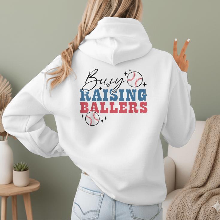 Busy Raising Ballers Retro Groovy Baseball Mom Outfit Women Hoodie Back Print