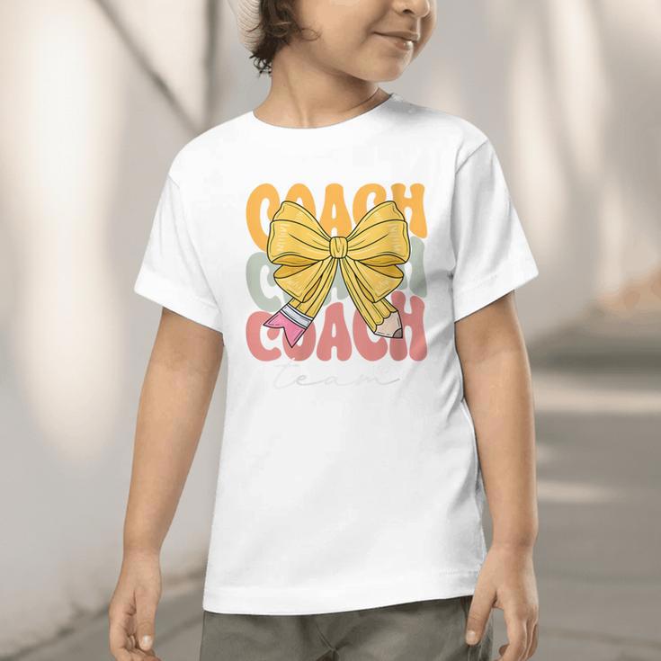 Coach Team Groovy Coquette Bow Cute Back To School Graphic Toddler T-Shirt Coach Team Groovy Coquette Bow Cute Back To School Graphic Toddler T-Shirt