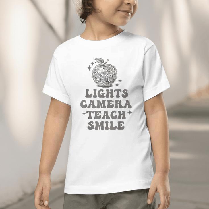 Lights Camera Teach Smile Disco-Ball Back To School Outfit Graphic Toddler T-Shirt Lights Camera Teach Smile Disco-Ball Back To School Outfit Graphic Toddler T-Shirt