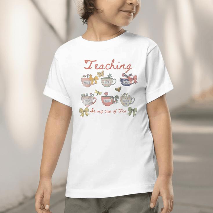 Teaching Is My Cup Of Tea Coquette Bow Floral Back To School Graphic Toddler T-Shirt Teaching Is My Cup Of Tea Coquette Bow Floral Back To School Graphic Toddler T-Shirt