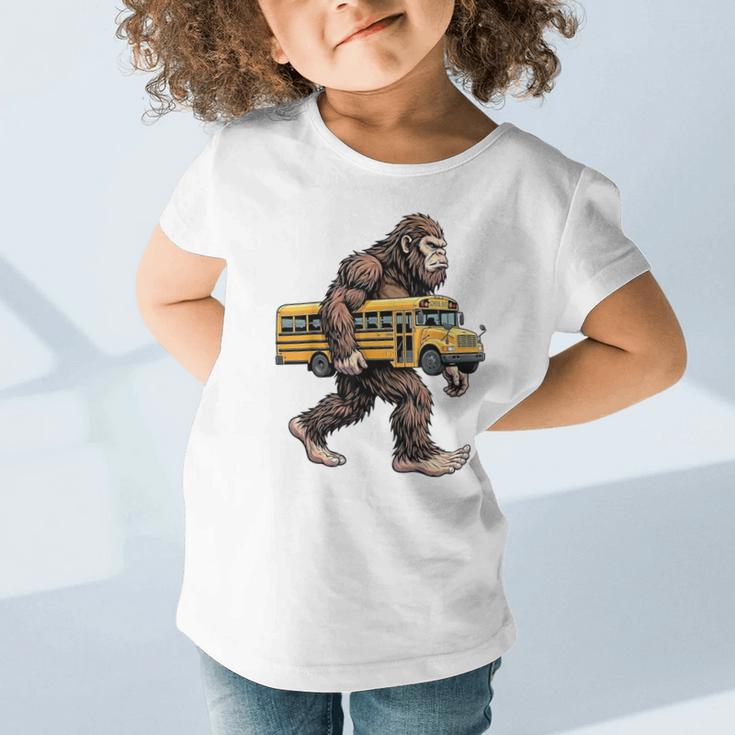 Bigfoot Carrying School Bus Sasquatch Back To School Graphic Toddler T-Shirt