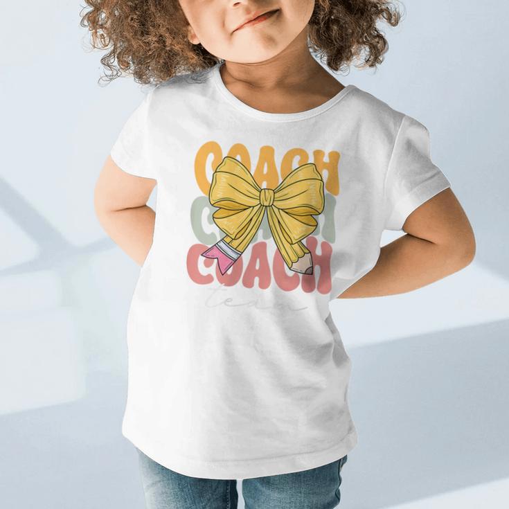 Coach Team Groovy Coquette Bow Cute Back To School Graphic Toddler T-Shirt Coach Team Groovy Coquette Bow Cute Back To School Graphic Toddler T-Shirt