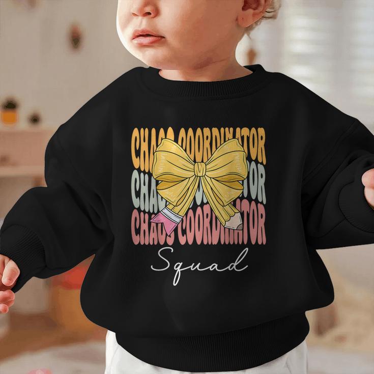 Chaos Coordinator Squad Groovy Coquette Bow Back To School Graphic Toddler Sweatshirt Chaos Coordinator Squad Groovy Coquette Bow Back To School Graphic Toddler Sweatshirt