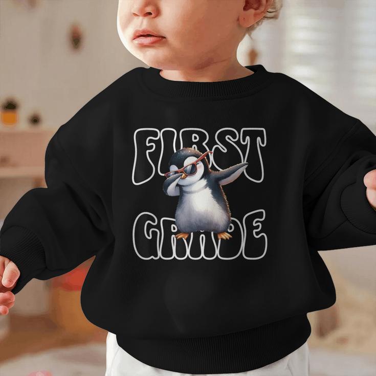 Cute Dabbing Penguin First Grade Back To School Graphic Toddler Sweatshirt Cute Dabbing Penguin First Grade Back To School Graphic Toddler Sweatshirt