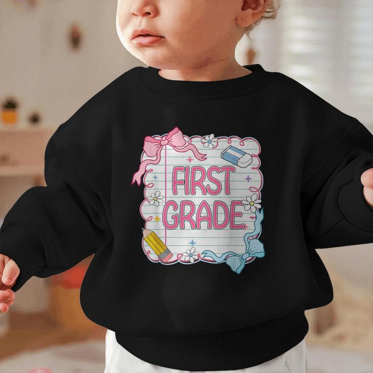 First Grade Back To School Girls Kids Coquette Bows Retro Graphic Toddler Sweatshirt First Grade Back To School Girls Kids Coquette Bows Retro Graphic Toddler Sweatshirt