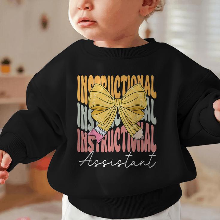 Instructional Assistant Groovy Coquette Bow Back To School Graphic Toddler Sweatshirt Instructional Assistant Groovy Coquette Bow Back To School Graphic Toddler Sweatshirt