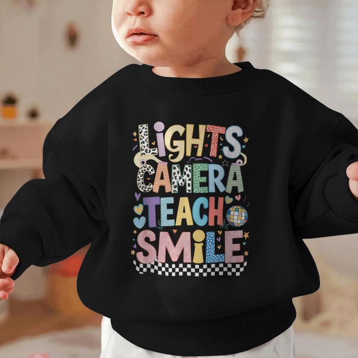 Lights Camera Teach Smile Back To School Awesome Learners Graphic Toddler Sweatshirt Lights Camera Teach Smile Back To School Awesome Learners Graphic Toddler Sweatshirt