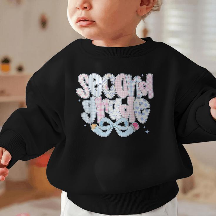 Second Grade Coquette Bow First Day Of School Back To School Graphic Toddler Sweatshirt Second Grade Coquette Bow First Day Of School Back To School Graphic Toddler Sweatshirt