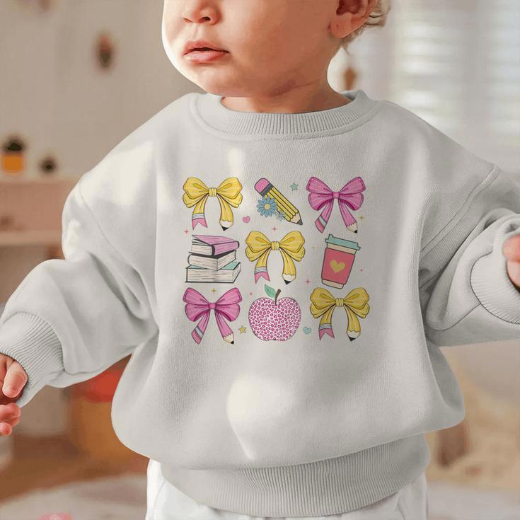 Apple Coquette Bow Books First Day Of School Back To School Graphic Toddler Sweatshirt Apple Coquette Bow Books First Day Of School Back To School Graphic Toddler Sweatshirt
