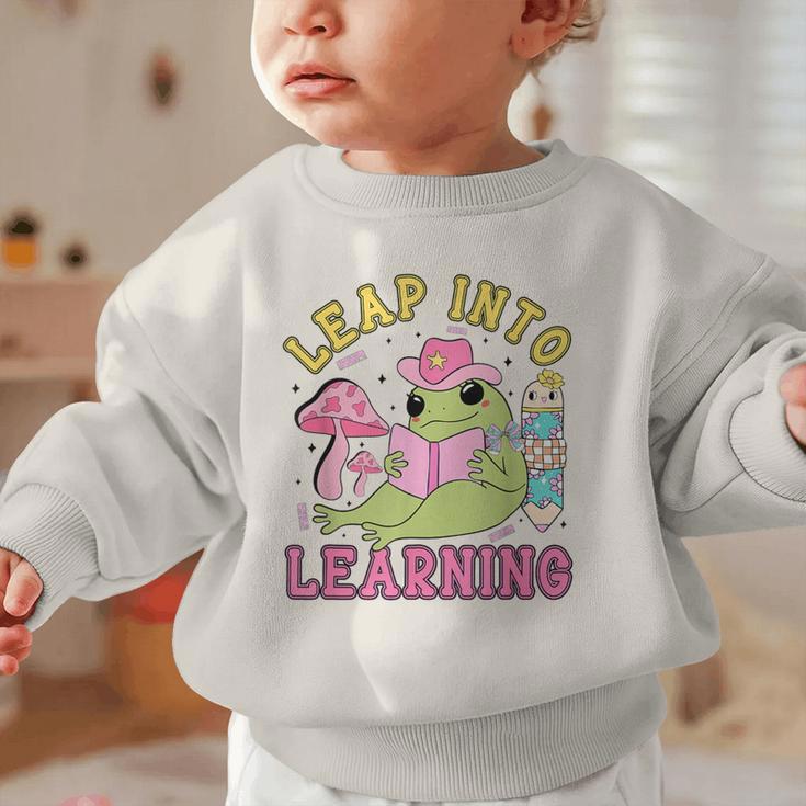 Leap Into Learning Cute Frog Kawaii Back To School Kids Graphic Toddler Sweatshirt Leap Into Learning Cute Frog Kawaii Back To School Kids Graphic Toddler Sweatshirt