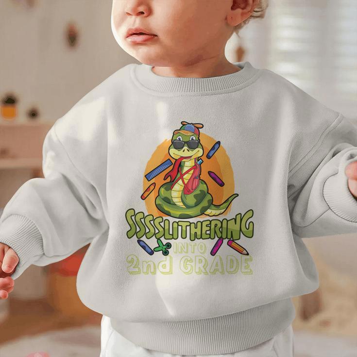 Slithering Into 2nd Grade First Day Back To School Snake Performance Graphic Toddler Sweatshirt Slithering Into 2nd Grade First Day Back To School Snake Performance Graphic Toddler Sweatshirt