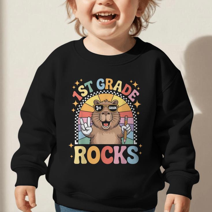 Back To School 1st Grade Capybara First Grade Rocks Graphic Toddler Sweatshirt Back To School 1st Grade Capybara First Grade Rocks Graphic Toddler Sweatshirt