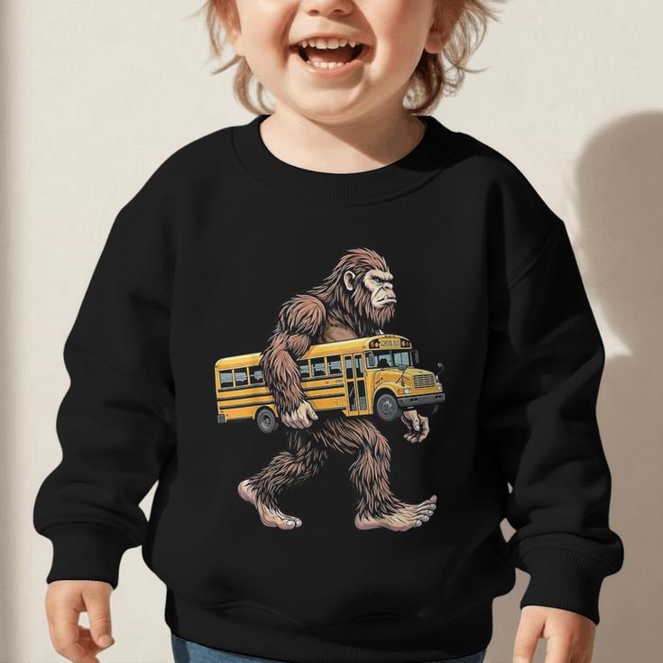 Bigfoot Carrying School Bus Sasquatch Back To School Graphic Toddler Sweatshirt