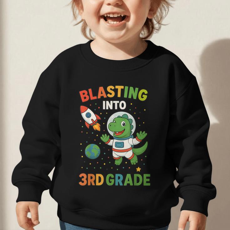 Blasting Into 3rd Grade Dinosaur Astronaut Back To School Graphic Toddler Sweatshirt Blasting Into 3rd Grade Dinosaur Astronaut Back To School Graphic Toddler Sweatshirt