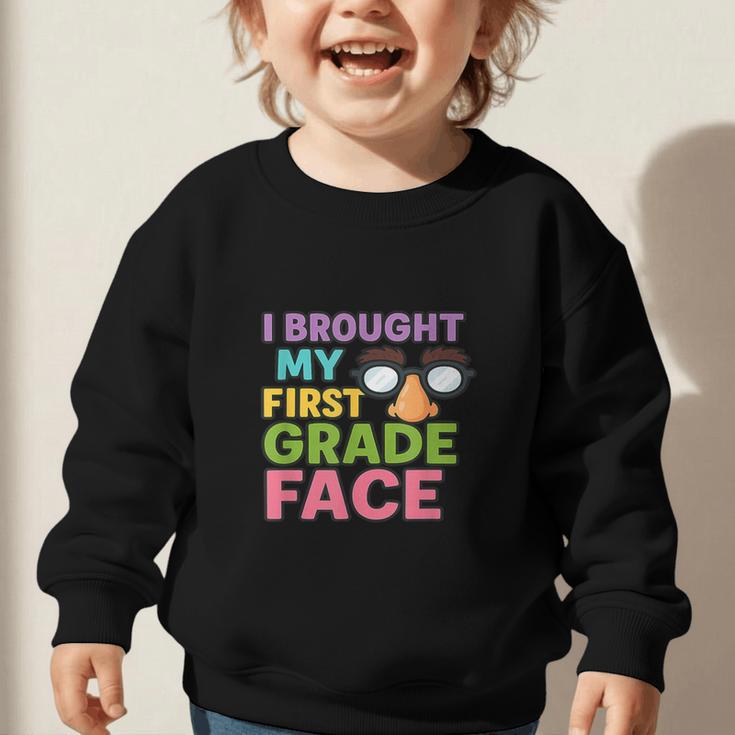 I Brought My First Grade Face First Day Back To School Graphic Toddler Sweatshirt