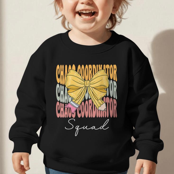 Chaos Coordinator Squad Groovy Coquette Bow Back To School Graphic Toddler Sweatshirt Chaos Coordinator Squad Groovy Coquette Bow Back To School Graphic Toddler Sweatshirt