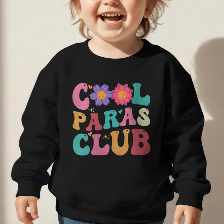 Cool Paras Club Paraprofessional Groovy Back To School Graphic Toddler Sweatshirt Cool Paras Club Paraprofessional Groovy Back To School Graphic Toddler Sweatshirt