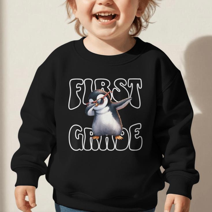 Cute Dabbing Penguin First Grade Back To School Graphic Toddler Sweatshirt Cute Dabbing Penguin First Grade Back To School Graphic Toddler Sweatshirt