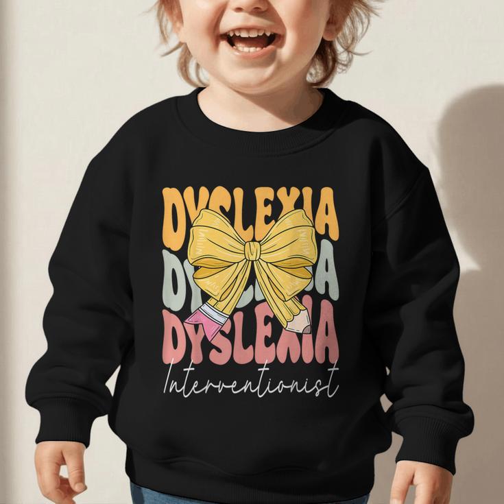 Dyslexia Interventionist Groovy Coquette Bow Back To School Graphic Toddler Sweatshirt