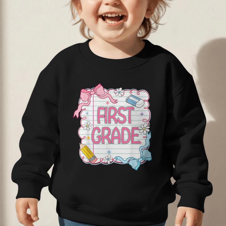 First Grade Back To School Girls Kids Coquette Bows Retro Graphic Toddler Sweatshirt First Grade Back To School Girls Kids Coquette Bows Retro Graphic Toddler Sweatshirt