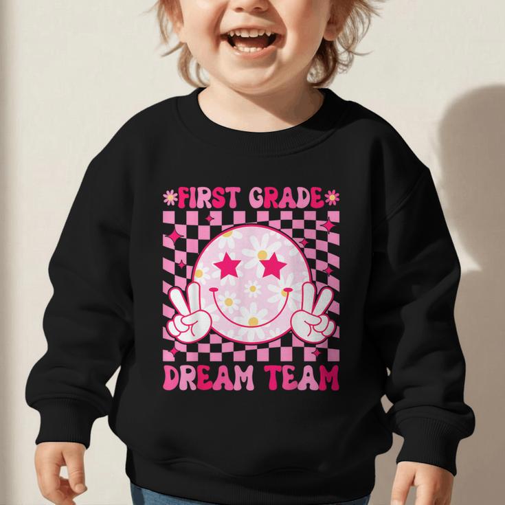 Groovy First Grade Dream Team Back To School 1st Grade Squad Graphic Toddler Sweatshirt